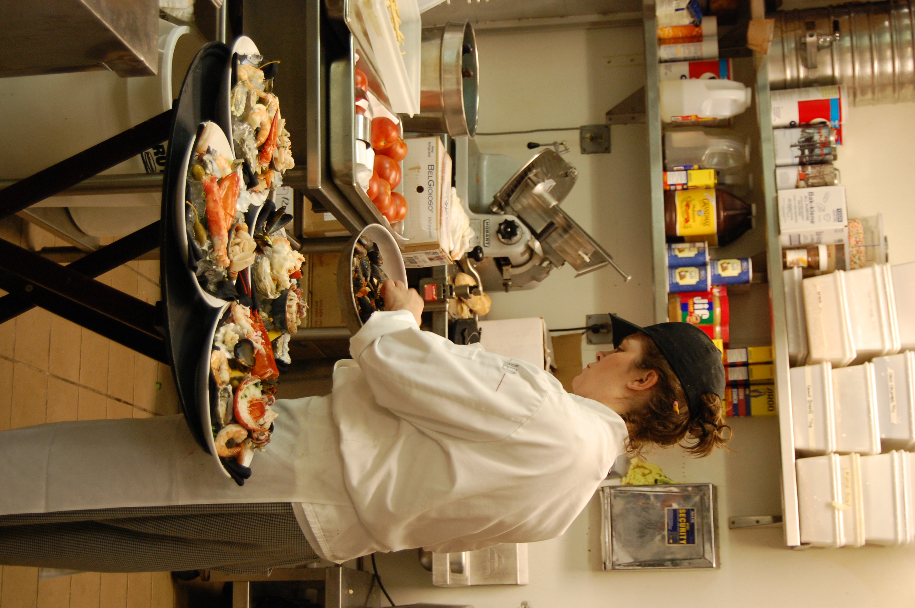 Chef at the pass under low light
